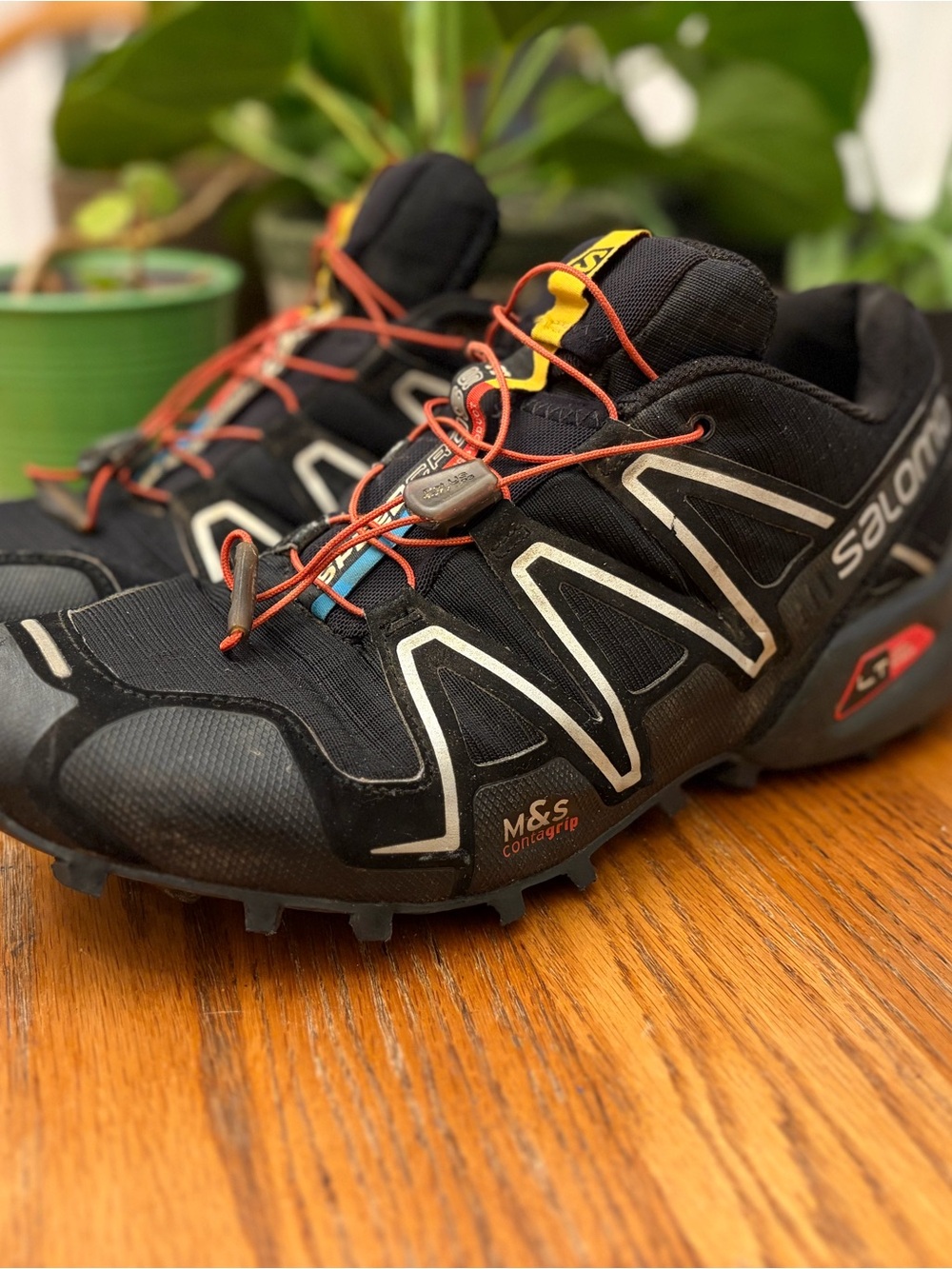 Salomon Black Athletic Trail Shoes with Orange Accents